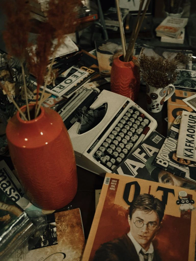 A worn paperback on a paper desk in late afternoon light